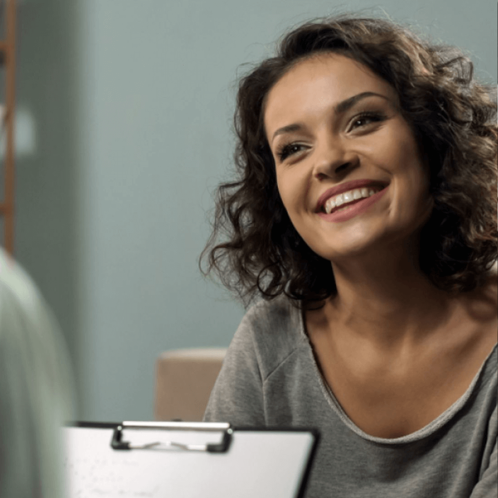 Smiling patient listening to podiatrist